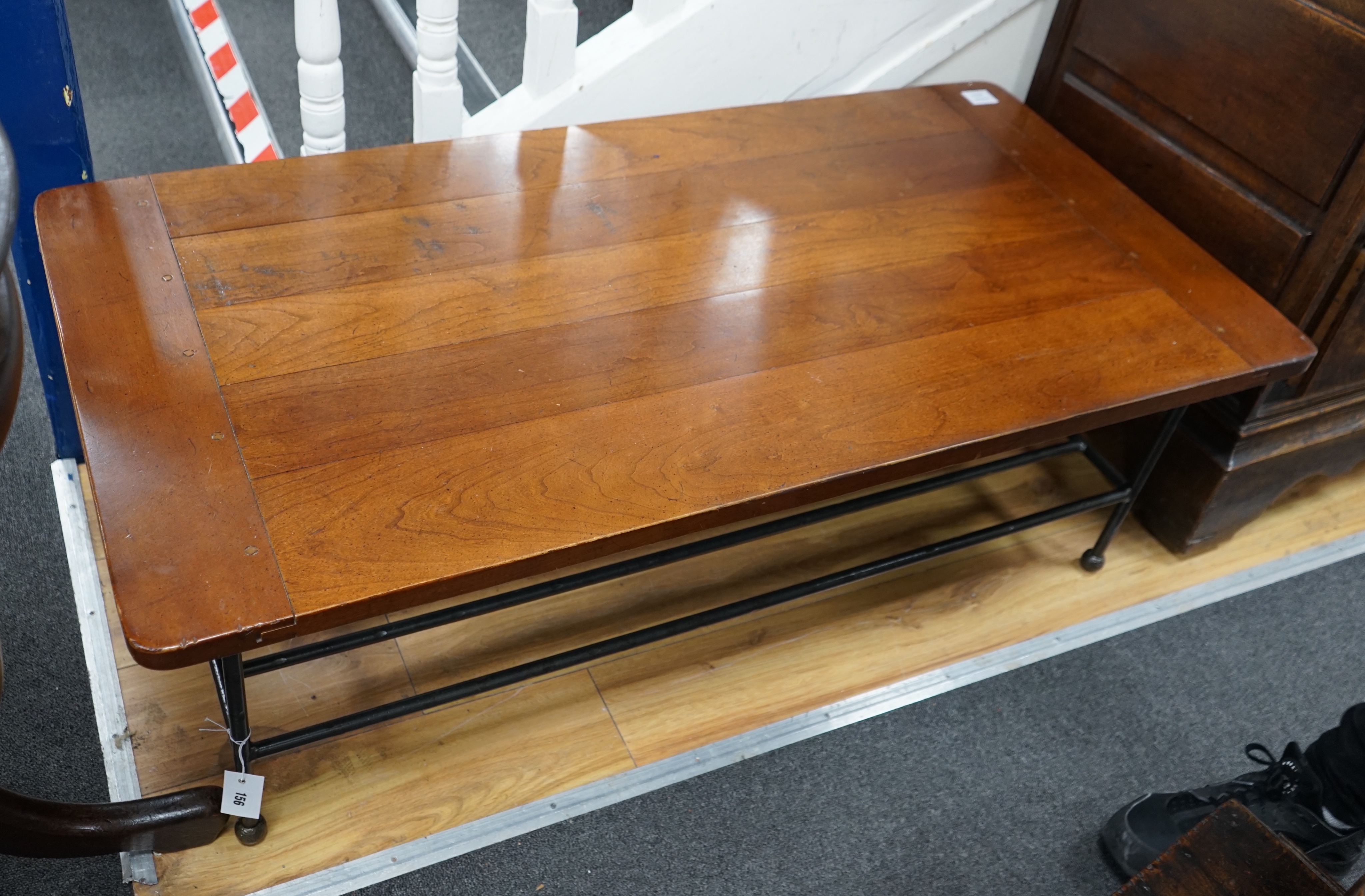 A modern rectanguar walnut and wrought iron coffee table, width 122cm depth 61cm height 41cm